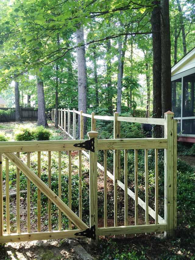 Completed side deer fence at the side of the property as well as finished picket fence that faces the front of the property