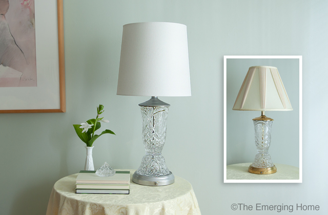 Updated crystal and glass table lamp with white drum shade sits on small table