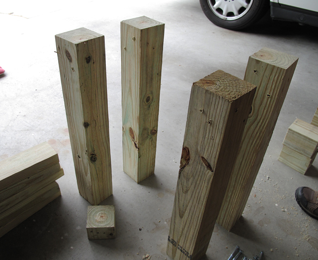 4 legs of rain barrel stand have been pre-drilled and are standing upright 