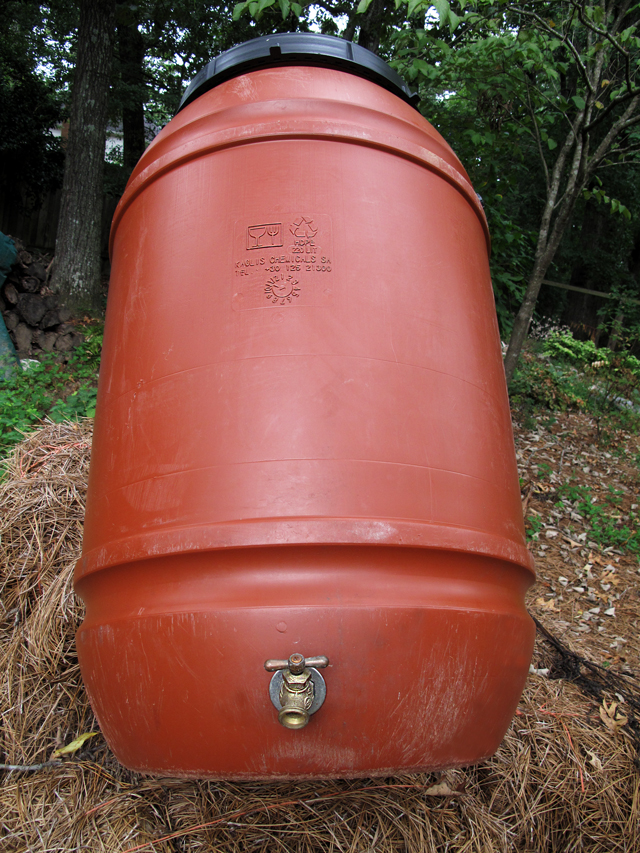 58 gallon water barrel showing HDPE symbol and spigot near bottom  