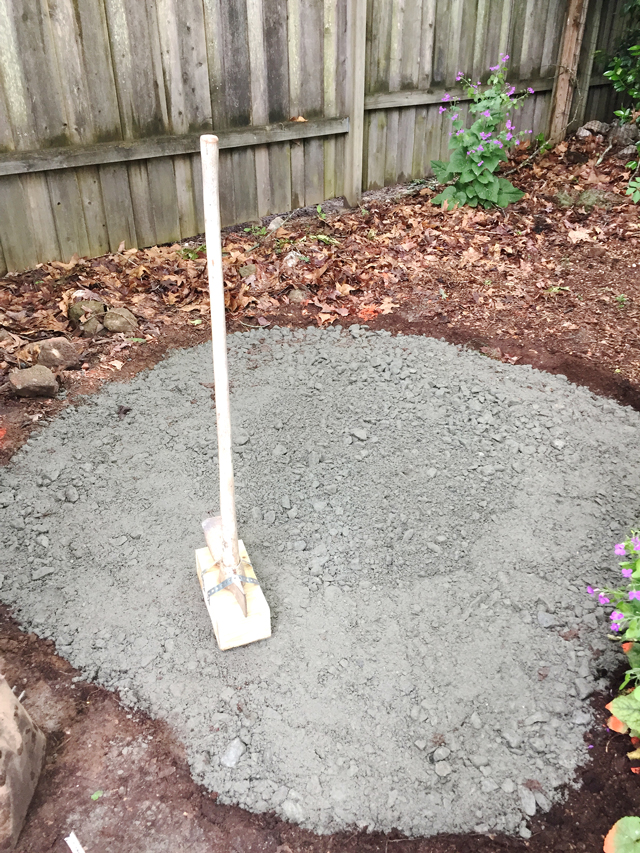 Granite base is tamped down to form hard base for sand and flagstones