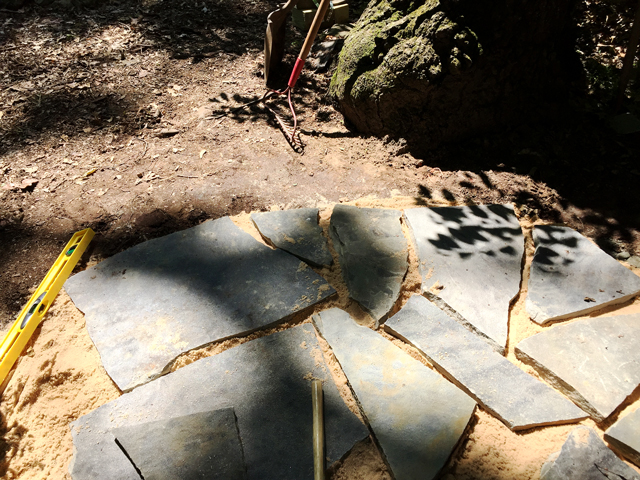 flagstones laid out on sand with minimum gaps between stones