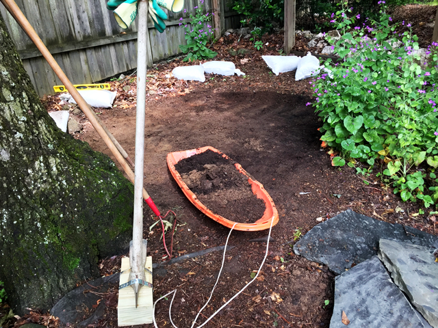 Removing excess soil from area 