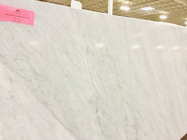 large slab of very light white marble with gray veining