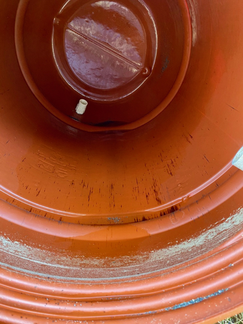 Rain barrel disassembled, showing dirt had collected primarily at top of barrel