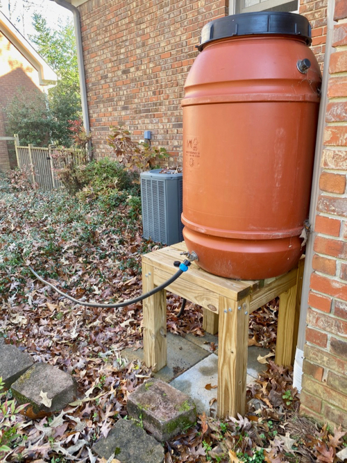 Connected Rain barrel on stand in outdoors