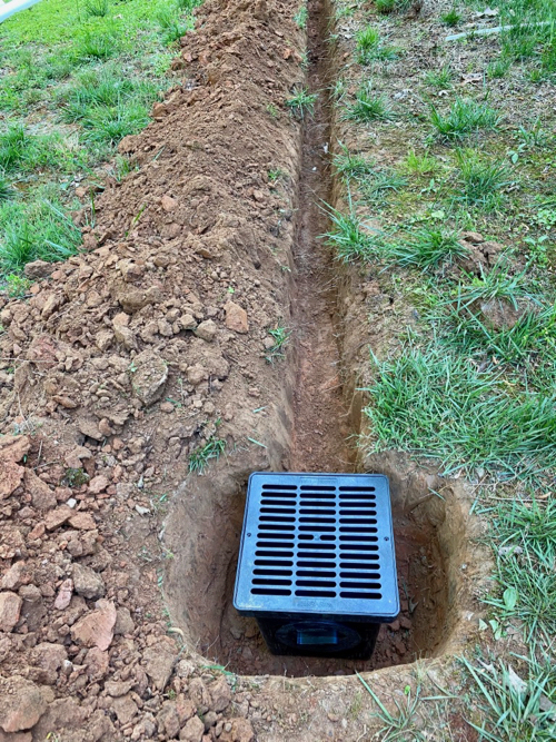 closeup of catch basin after ditch is fully dug