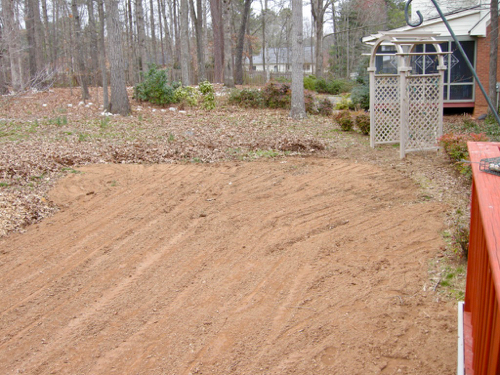 soil is spread over the play side of the yard