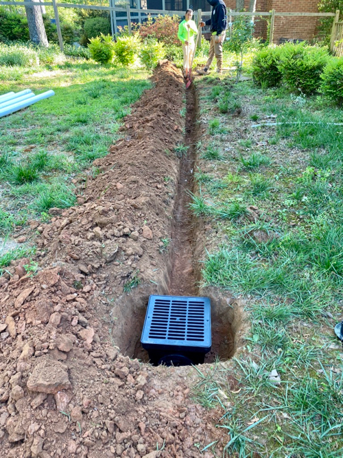 ditch has been dug and catch basin is set in place