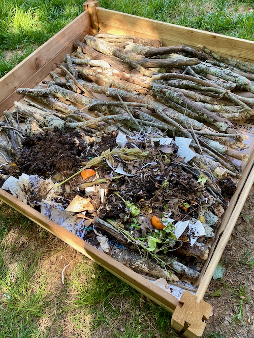 Partially decomposed compost added  to raised bed