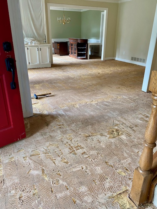 Living room floor engineered wood floor has been removed with little damage to subfloor